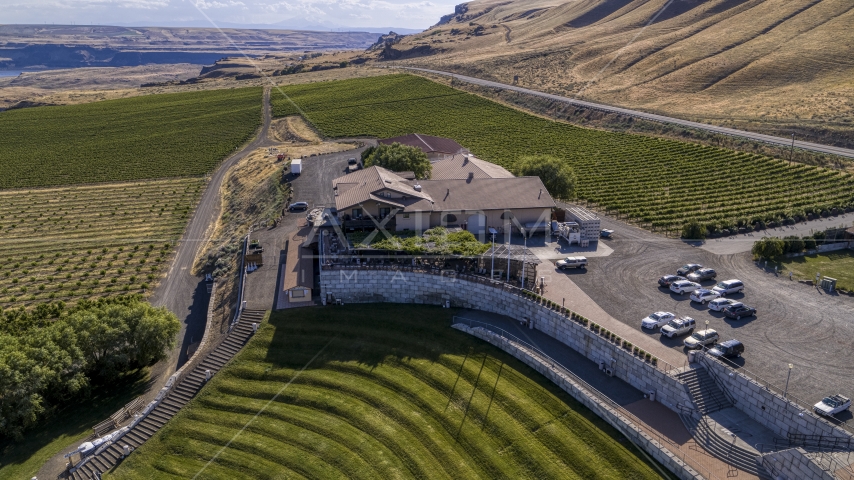 Maryhill Winery and grapevines seen from the amphitheater in Goldendale, Washington Aerial Stock Photo DXP001_018_0023 | Axiom Images
