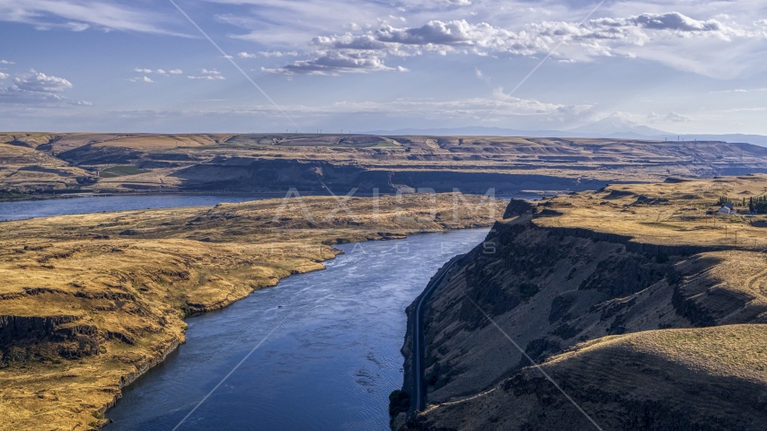 A view of Miller Island and the Columbia River seen from the edge of a cliff in Goldendale, Washington Aerial Stock Photo DXP001_019_0010 | Axiom Images
