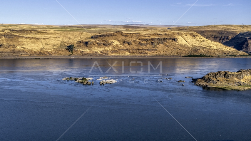 Small rock formations in the Columbia River in Goldendale, Washington Aerial Stock Photo DXP001_019_0014 | Axiom Images