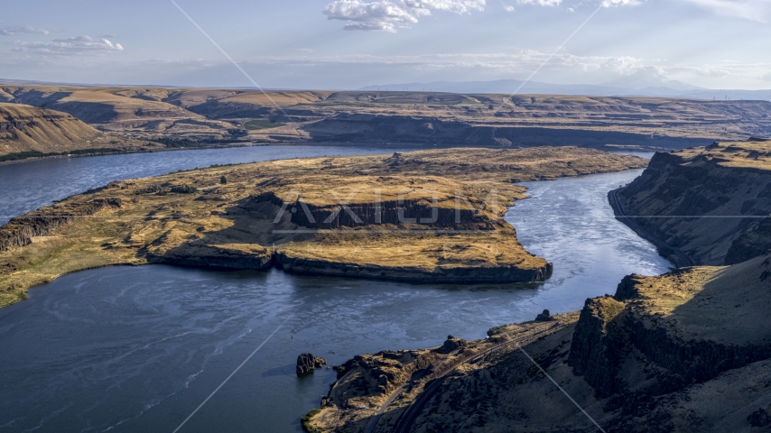 A view of Miller Island and the Columbia River seen from steep cliffs in Goldendale, Washington Aerial Stock Photo DXP001_019_0024 | Axiom Images