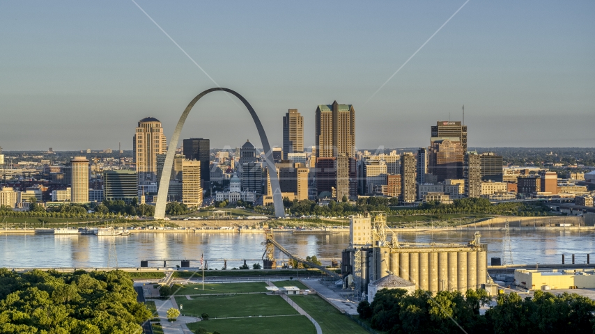 The Arch and city skyline across the Mississippi River at sunrise, Downtown St. Louis, Missouri Aerial Stock Photo DXP001_021_0001 | Axiom Images