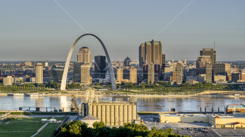 A grain elevator and casino against The Arch and skyline at sunrise, Downtown St. Louis, Missouri Aerial Stock Photo DXP001_021_0003 | Axiom Images