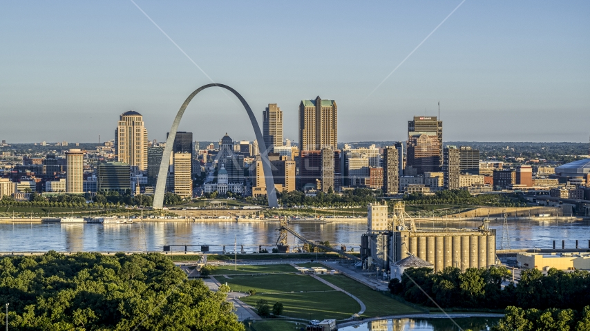The Arch and skyline seen from a park across the Mississippi River, sunrise, Downtown St. Louis, Missouri Aerial Stock Photo DXP001_021_0005 | Axiom Images