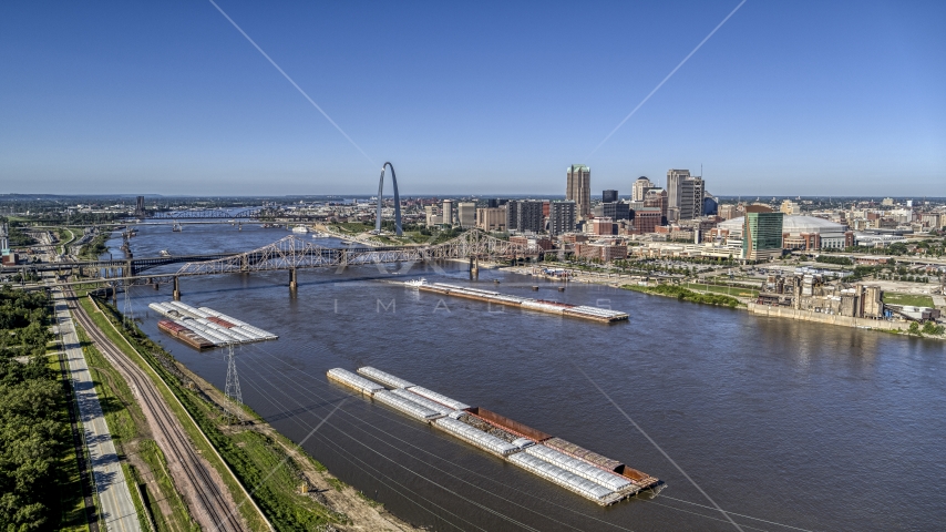 Barges in the river near the Gateway Arch in Downtown St. Louis, Missouri Aerial Stock Photo DXP001_023_0002 | Axiom Images