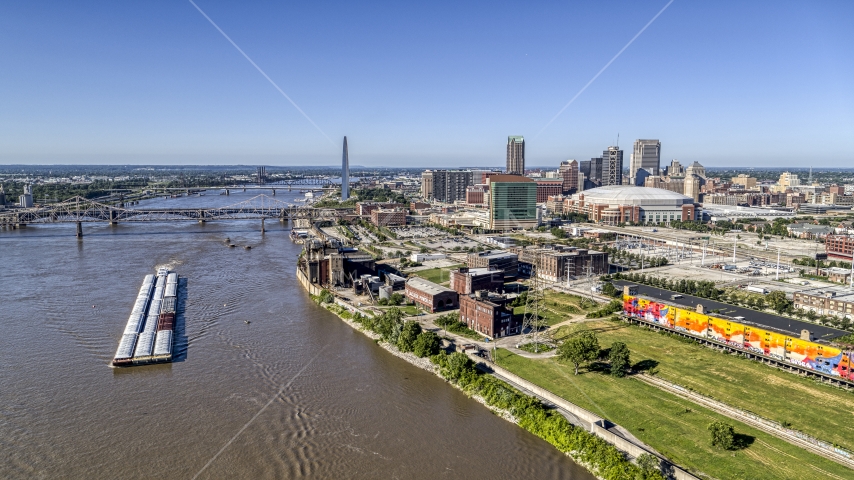 Riverfront buildings and river barge in Downtown St. Louis, Missouri Aerial Stock Photo DXP001_023_0003 | Axiom Images