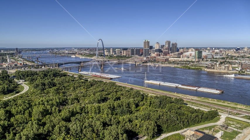 Barges on the river and the Gateway Arch, Downtown St. Louis, Missouri Aerial Stock Photo DXP001_023_0004 | Axiom Images