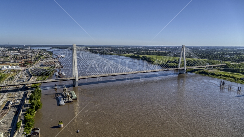 A cable-stayed bridge spanning the Mississippi River revealing barges, St. Louis, Missouri Aerial Stock Photo DXP001_023_0006 | Axiom Images
