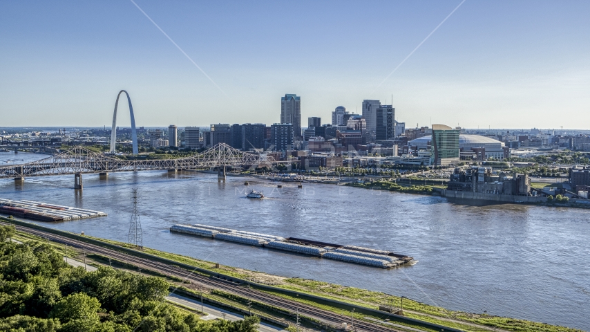 A view of a barge on the river, and bridge near Gateway Arch, Downtown St. Louis, Missouri Aerial Stock Photo DXP001_026_0001 | Axiom Images