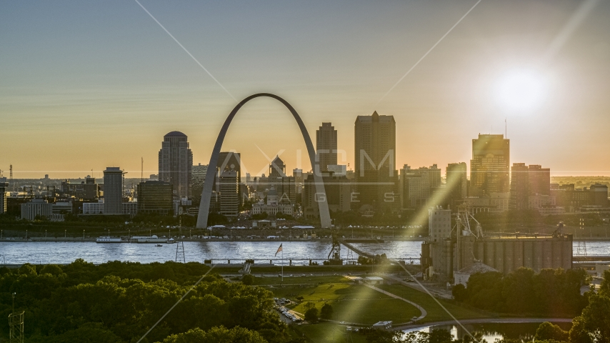 The setting sun behind the Downtown St. Louis, Missouri skyline Aerial Stock Photo DXP001_028_0001 | Axiom Images