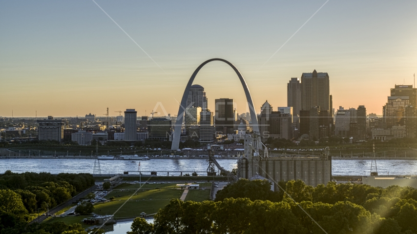 The famous Gateway Arch at sunset in Downtown St. Louis, Missouri Aerial Stock Photo DXP001_028_0003 | Axiom Images