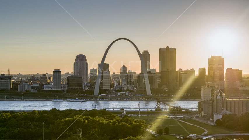 A view of the famous Gateway Arch and the Downtown St. Louis, Missouri skyline at sunset Aerial Stock Photo DXP001_028_0004 | Axiom Images