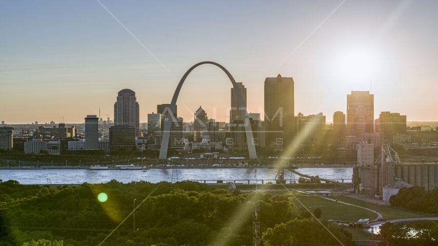 The Arch and Downtown St. Louis, Missouri skyline with setting sun in background Aerial Stock Photo DXP001_028_0005 | Axiom Images