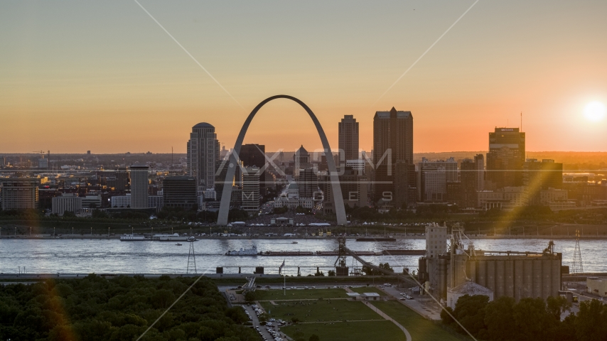 The iconic Gateway Arch and Downtown St. Louis skyline, Missouri at sunset Aerial Stock Photo DXP001_029_0002 | Axiom Images