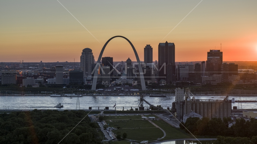 Downtown St. Louis, Missouri skyline and the Gateway Arch across the river at sunset Aerial Stock Photo DXP001_029_0004 | Axiom Images