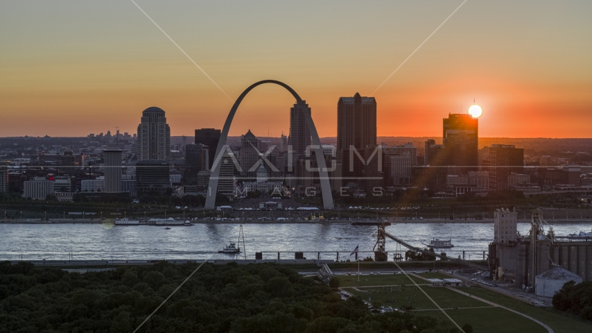 Gateway Arch and Downtown St. Louis, Missouri skyline with the setting sun in the background Aerial Stock Photo DXP001_029_0006 | Axiom Images