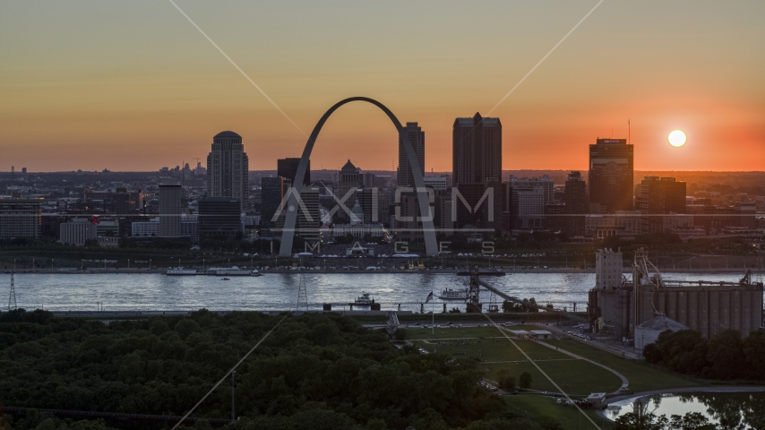 The historic Gateway Arch and Downtown St. Louis skyline, Missouri at sunset Aerial Stock Photo DXP001_029_0007 | Axiom Images