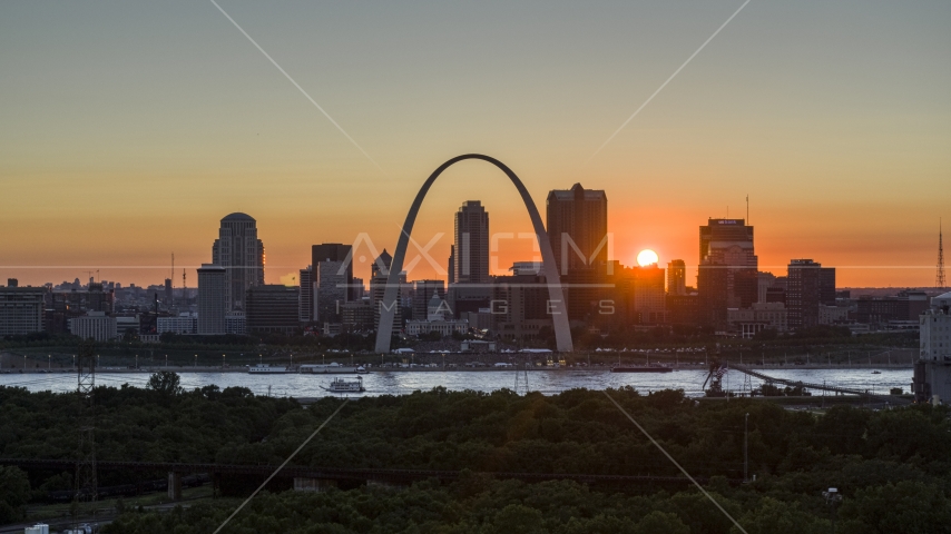 Aerial stock photo of the Gateway Arch and the Downtown St. Louis, Missouri skyline in silhouette at sunset Aerial Stock Photo DXP001_029_0008 | Axiom Images