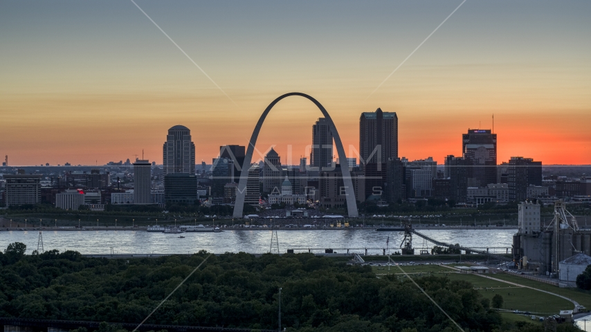 Gateway Arch and Downtown St. Louis, Missouri skyline in silhouette at sunset Aerial Stock Photo DXP001_029_0012 | Axiom Images