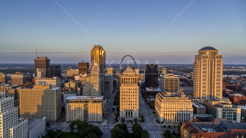 Gateway Arch visible behind the courthouses in downtown at sunset, Downtown St. Louis, Missouri Aerial Stock Photo DXP001_035_0011 | Axiom Images