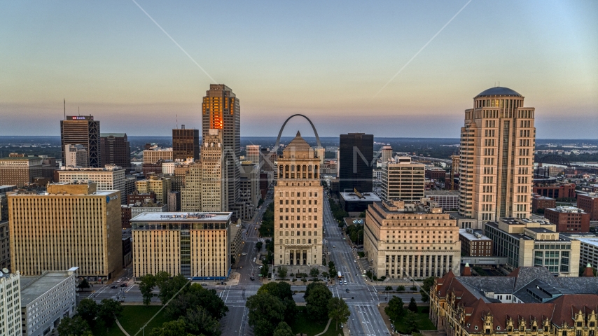 The Arch behind the courthouses and skyscrapers at twilight, Downtown St. Louis, Missouri Aerial Stock Photo DXP001_036_0004 | Axiom Images