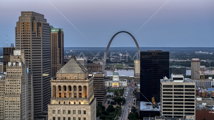 The Gateway Arch and museum at twilight, seen across Downtown St. Louis, Missouri Aerial Stock Photo DXP001_036_0012 | Axiom Images