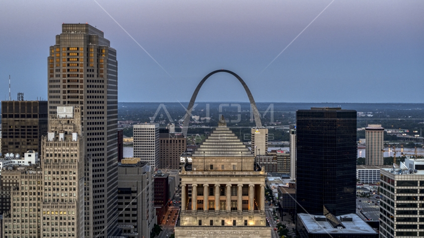 Gateway Arch at twilight, visible from a courthouse in Downtown St. Louis, Missouri Aerial Stock Photo DXP001_036_0014 | Axiom Images