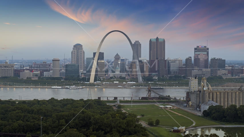 The Arch and skyline in Downtown St. Louis, Missouri, by Mississippi River at twilight Aerial Stock Photo DXP001_037_0008 | Axiom Images