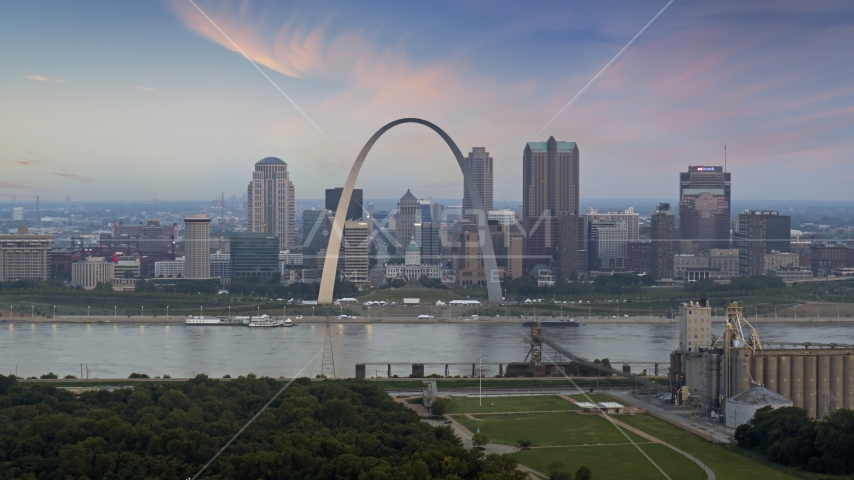The Arch and skyline in Downtown St. Louis, Missouri, by Mississippi River at twilight Aerial Stock Photo DXP001_037_0010 | Axiom Images