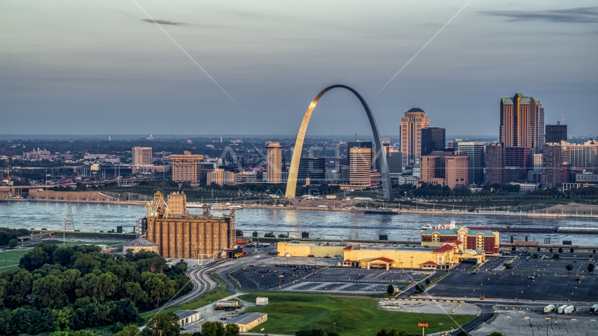Sunlight on the St. Louis Arch by the Mississippi River at sunrise in Downtown St. Louis, Missouri Aerial Stock Photo DXP001_038_0005 | Axiom Images