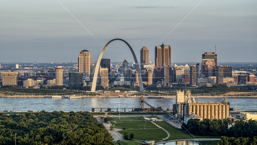 A view of the St. Louis Arch and the city skyline at sunrise in Downtown St. Louis, Missouri Aerial Stock Photo DXP001_038_0007 | Axiom Images