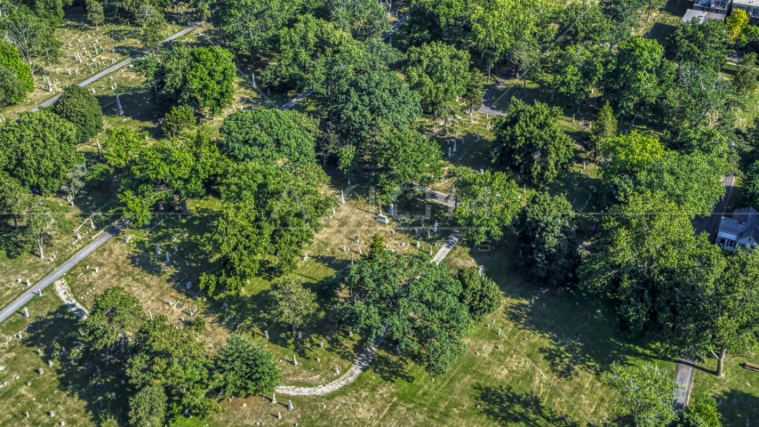 Gravestones and trees at a cemetery in Kansas City, Missouri Aerial Stock Photo DXP001_044_0004 | Axiom Images
