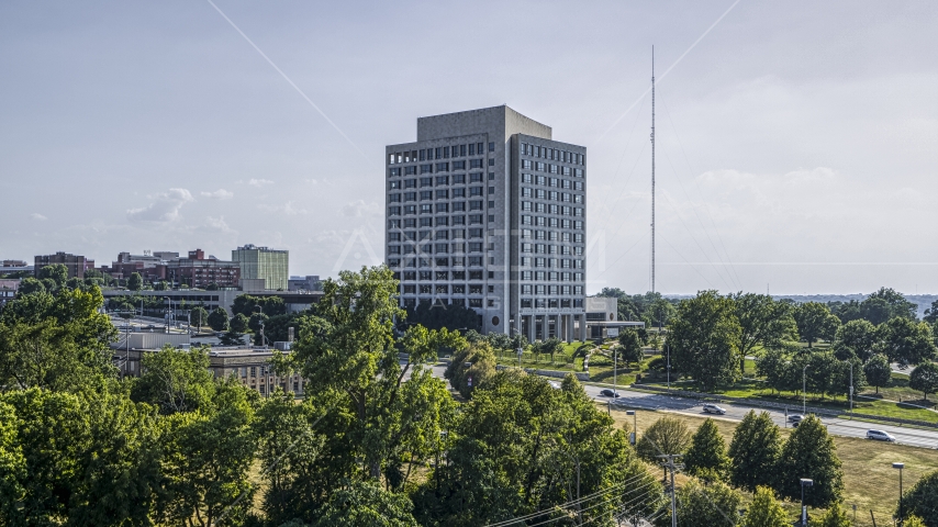 A government office building seen from trees in Kansas City, Missouri Aerial Stock Photo DXP001_044_0010 | Axiom Images