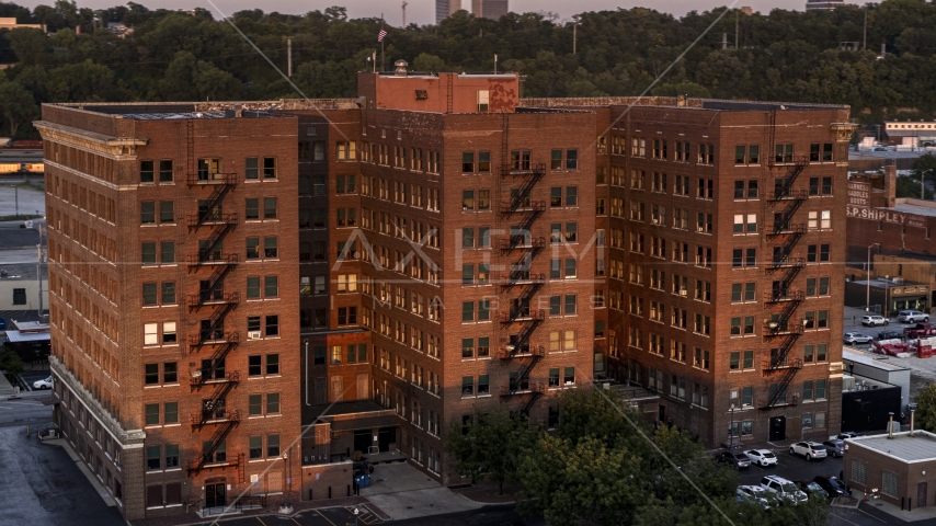 A brick office building at twilight in Kansas City, Missouri Aerial Stock Photo DXP001_046_0003 | Axiom Images