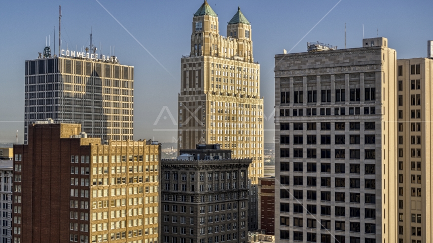 909 Walnut skyscraper between two neighboring skyscrapers in Downtown Kansas City, Missouri Aerial Stock Photo DXP001_048_0002 | Axiom Images