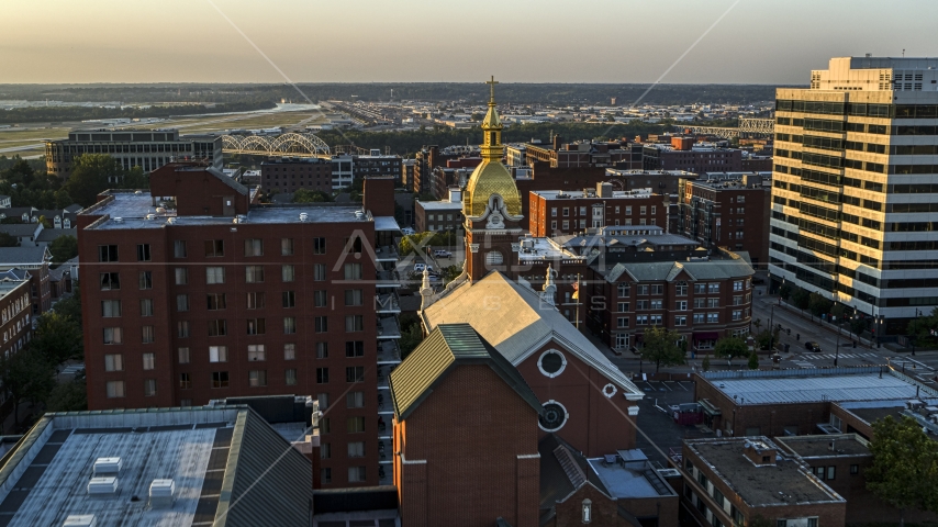 A cathedral steeple at sunset in Downtown Kansas City, Missouri Aerial Stock Photo DXP001_051_0001 | Axiom Images
