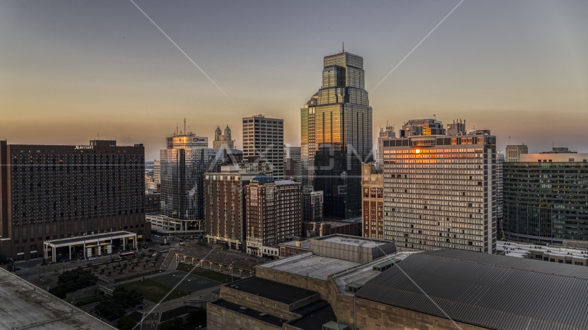 One Kansas City Place towering over other skyscrapers at sunset in Downtown Kansas City, Missouri Aerial Stock Photo DXP001_051_0011 | Axiom Images