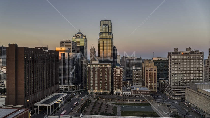 Towering downtown skyscrapers at twilight in Downtown Kansas City, Missouri Aerial Stock Photo DXP001_051_0013 | Axiom Images