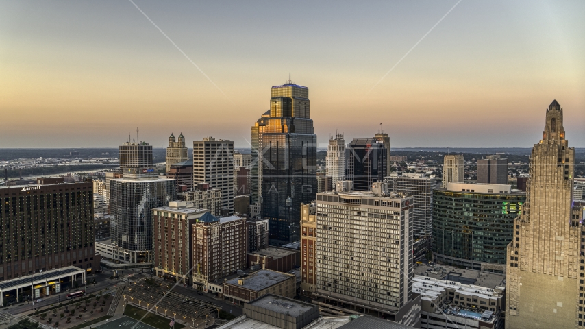 A group of skyscrapers and city buildings at twilight in Downtown Kansas City, Missouri Aerial Stock Photo DXP001_051_0014 | Axiom Images