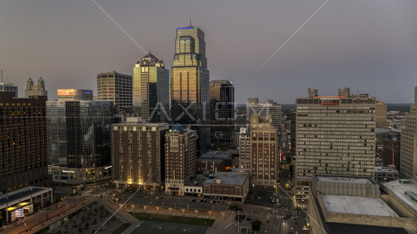 Skyscrapers between hotels and office buildings at twilight in Downtown Kansas City, Missouri Aerial Stock Photo DXP001_051_0021 | Axiom Images