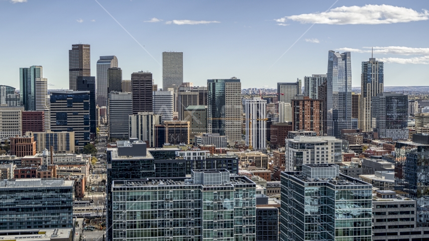 The city's skyline seen from office building rooftops in Downtown Denver, Colorado Aerial Stock Photo DXP001_055_0006 | Axiom Images