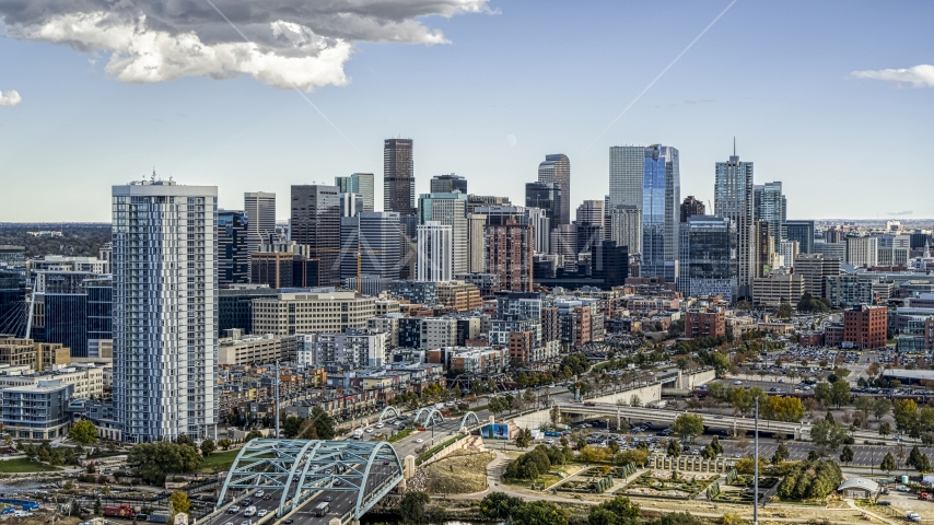 The city's skyline and a residential skyscraper in Downtown Denver, Colorado Aerial Stock Photo DXP001_055_0011 | Axiom Images