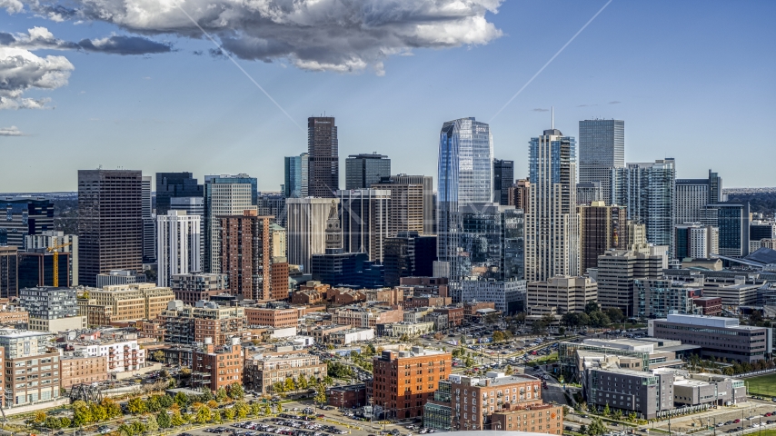 A view of the tall towers of the city skyline in Downtown Denver, Colorado Aerial Stock Photo DXP001_055_0017 | Axiom Images