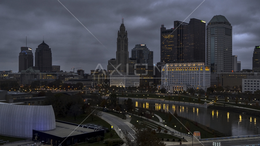 A view of city skyline at twilight from near the river in Downtown Columbus, Ohio Aerial Stock Photo DXP001_087_0010 | Axiom Images