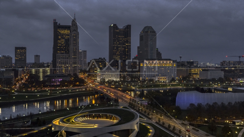 The city's downtown skyline across the bridge and river at twilight, Downtown Columbus, Ohio Aerial Stock Photo DXP001_088_0005 | Axiom Images