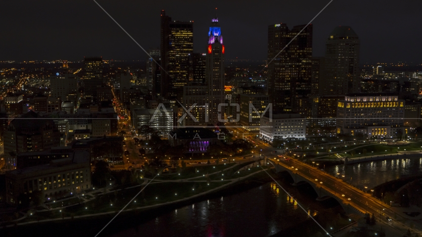 The city skyline, and bridge spanning the river at night, Downtown Columbus, Ohio Aerial Stock Photo DXP001_088_0013 | Axiom Images