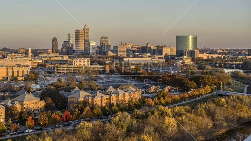 The city's skyline seen from the White River at sunset, Downtown Indianapolis, Indiana Aerial Stock Photo DXP001_092_0005 | Axiom Images