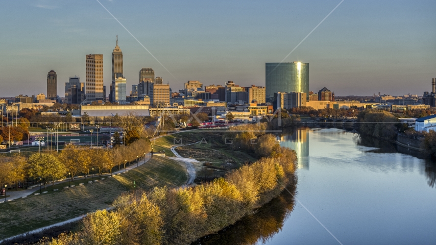 The city's skyline at sunset seen from White River, Downtown Indianapolis, Indiana Aerial Stock Photo DXP001_092_0007 | Axiom Images
