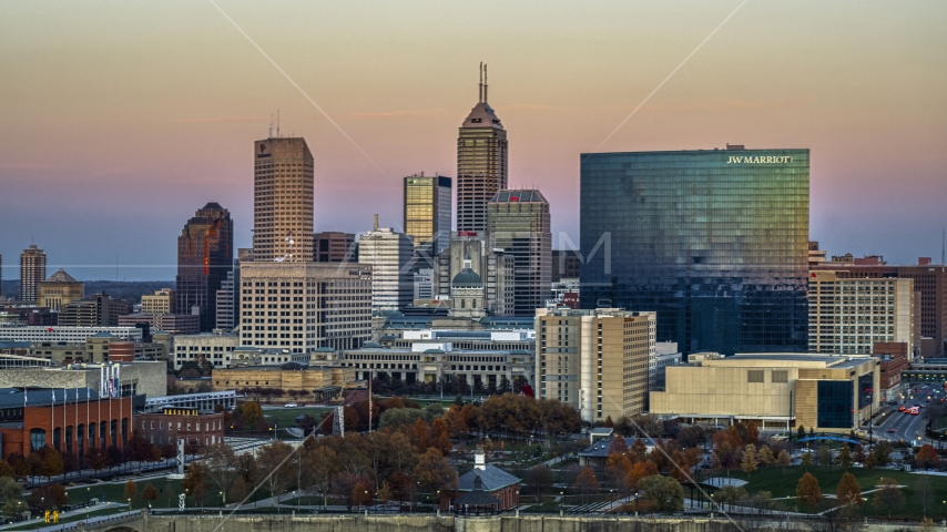A hotel and view of the city's skyline at sunset, Downtown Indianapolis, Indiana Aerial Stock Photo DXP001_092_0014 | Axiom Images