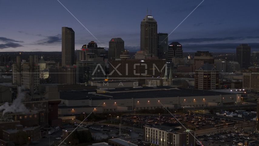 Smoke stacks at twilight with skyline in background, Downtown Indianapolis, Indiana Aerial Stock Photo DXP001_093_002 | Axiom Images