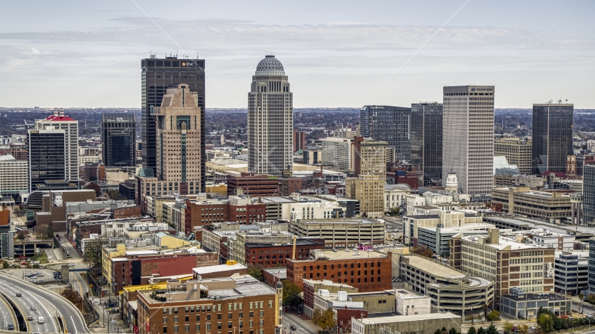 City skyline seen from brick buildings in Downtown Louisville, Kentucky Aerial Stock Photo DXP001_095_0001 | Axiom Images